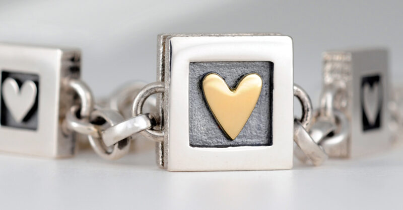 A silver bracelet with personalised hearts Price varies depending on  hearts chosen  Beautiful Moments Jewellery